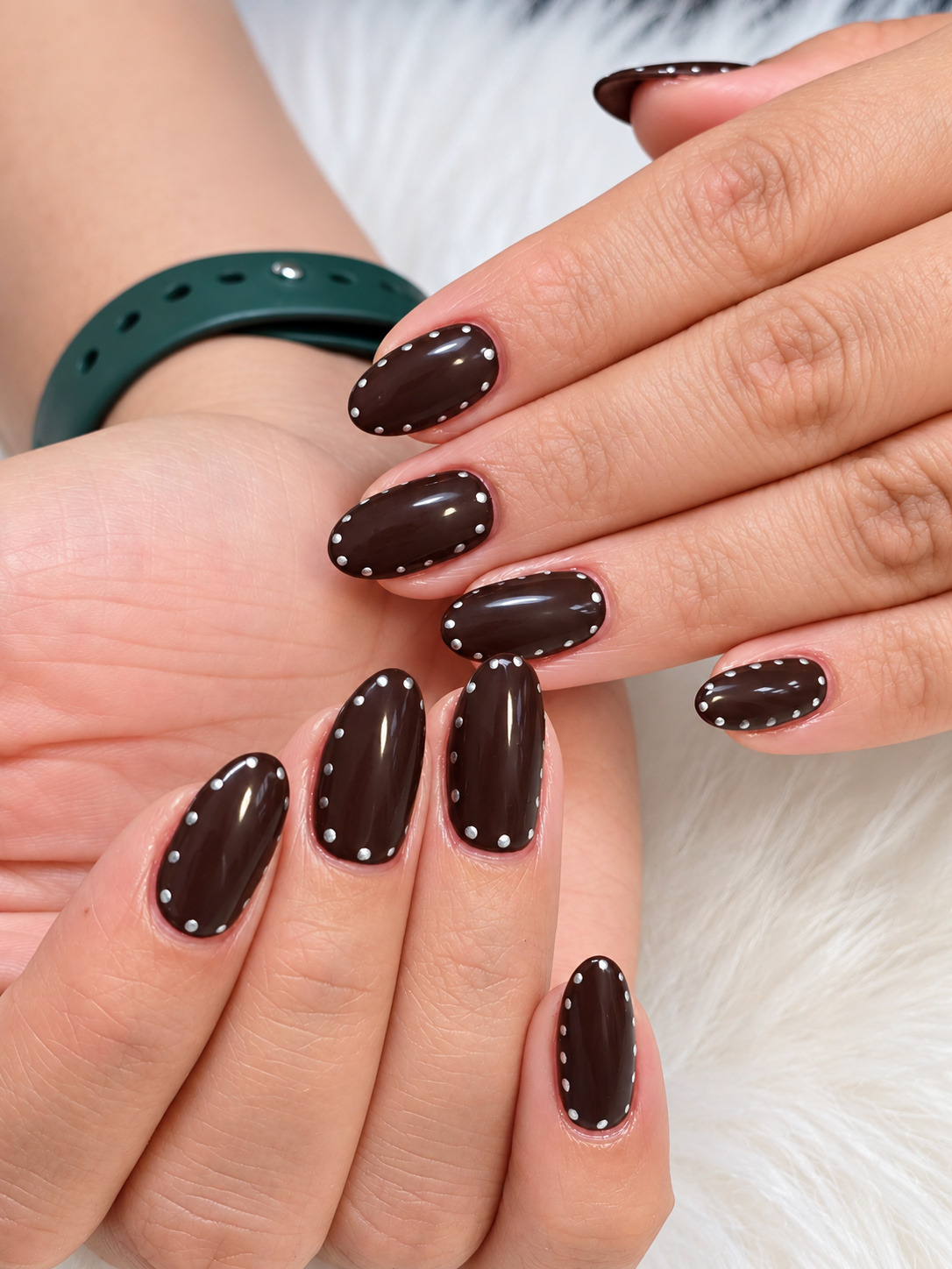 Chocolate brown oval nails with white dotted outline accents by AN Nail Spa
