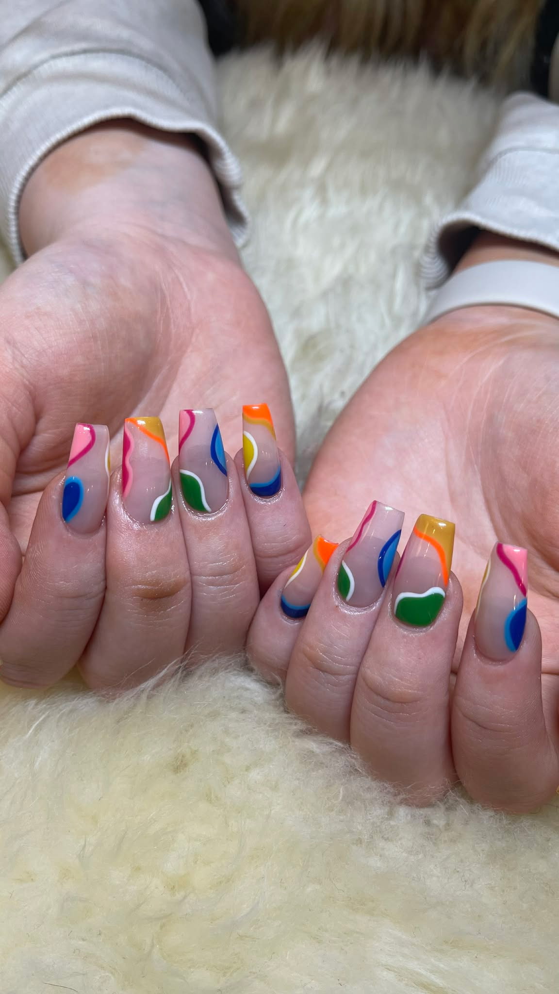 Colorful abstract rainbow nail art on coffin nails by AN Nail Spa Toronto